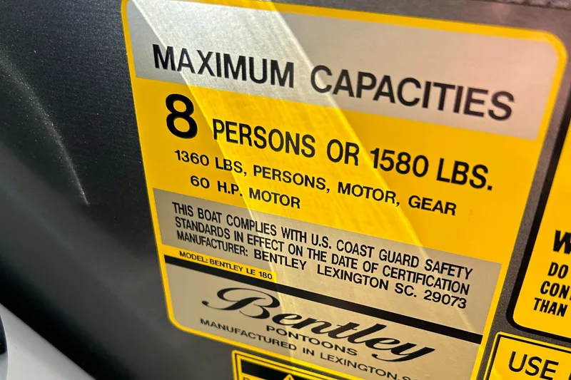 Slide: The Image of 2024 Bentley Pontoons LE 180 CR capacity label: 8 persons, 1580 lbs, 60 HP motor. - 9