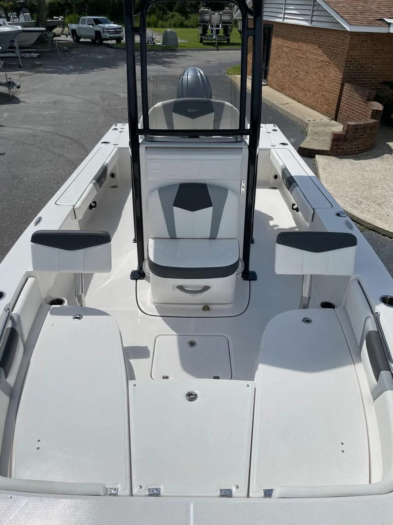 Slide: The Image of 2024 Robalo 226 Cayman boat interior with seating and storage compartments. - 13