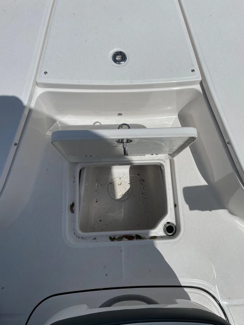 Slide: The Image of 2024 Robalo 226 Cayman boat storage compartment. - 7