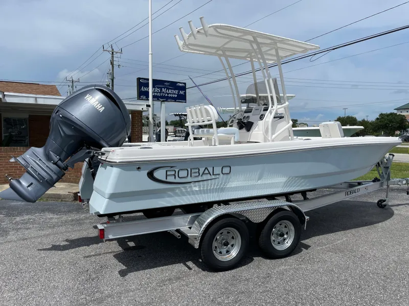 Slide: The Image of 2024 Robalo 206 Cayman boat on a trailer with Yamaha outboard motor. - 2