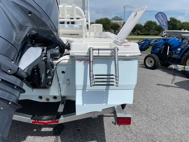 Slide: The Image of 2024 Robalo 206 Cayman boat rear view with motor and ladder. - 5