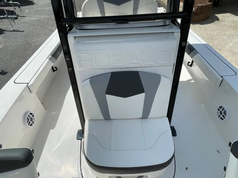 Slide: The Image of 2024 Robalo 226 Cayman boat interior seating and console. - 5