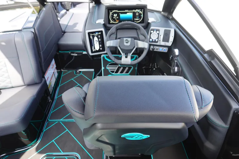 Slide: The Image of 2023 Malibu 25 LSV boat interior with modern dashboard and seating. - 15