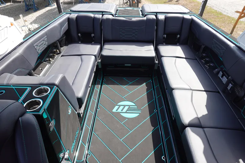 Slide: The Image of 2023 Malibu 25 LSV boat interior with spacious seating and modern design. - 18