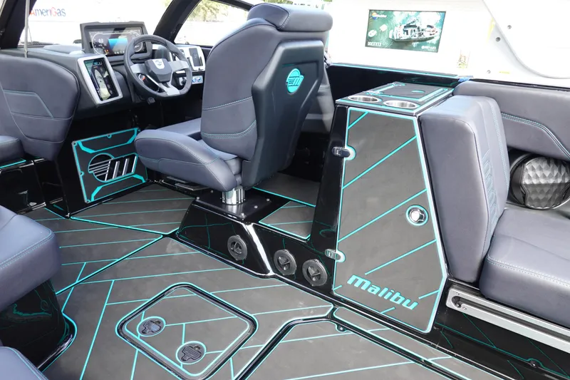 Slide: The Image of 2023 Malibu 25 LSV boat interior with modern design and advanced dashboard. - 21