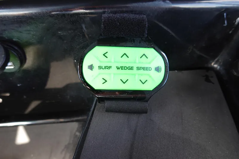 Slide: The Image of Control panel of 2023 Malibu 25 LSV boat with surf, wedge, and speed settings. - 39