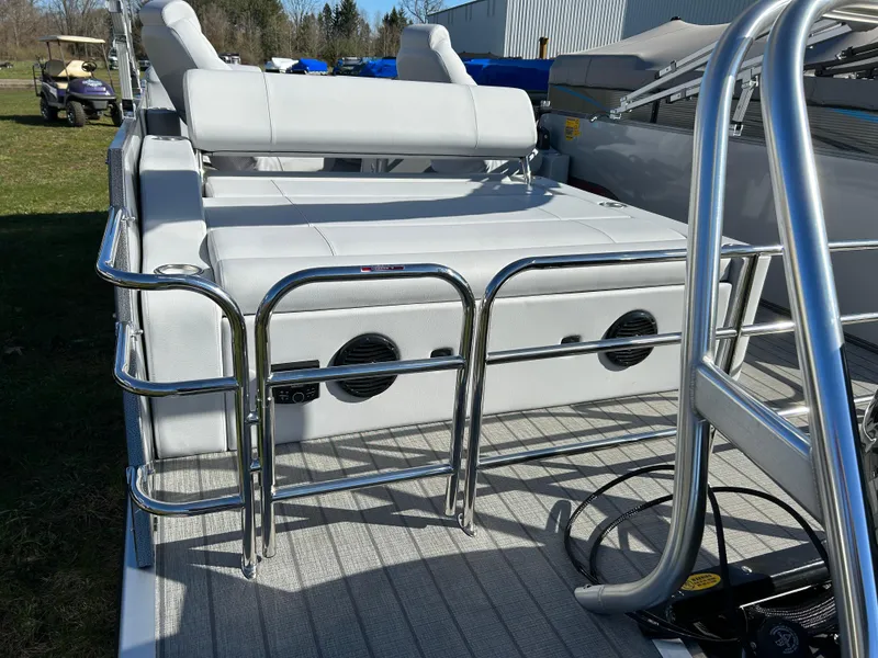 Slide: The Image of 2024 Bentley Pontoons Legacy Swingback 220 with sleek seating and stainless steel railings. - 13