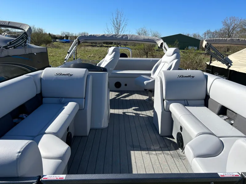 Slide: The Image of 2024 Bentley Pontoons Legacy Swingback 220 interior with luxurious seating. - 3