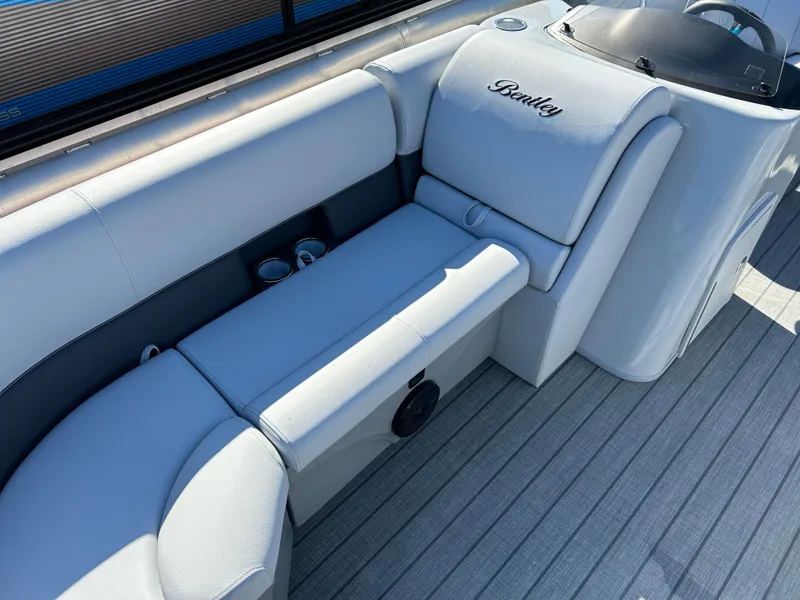 Slide: The Image of 2024 Bentley Pontoons Legacy Swingback 220 interior seating area. - 4