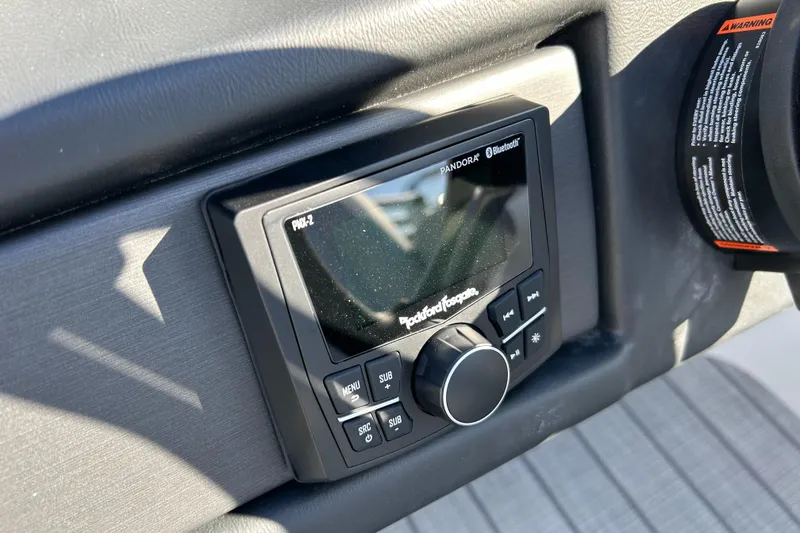 Slide: The Image of 2024 Bentley Pontoons Legacy Swingback 220 dashboard with Rockford Fosgate audio system. - 9