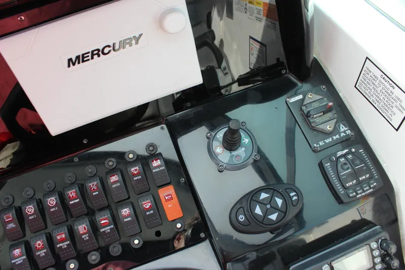 Slide: The Image of Control panel of a 2011 Rinker 310 Express Cruiser with Mercury system. - 24