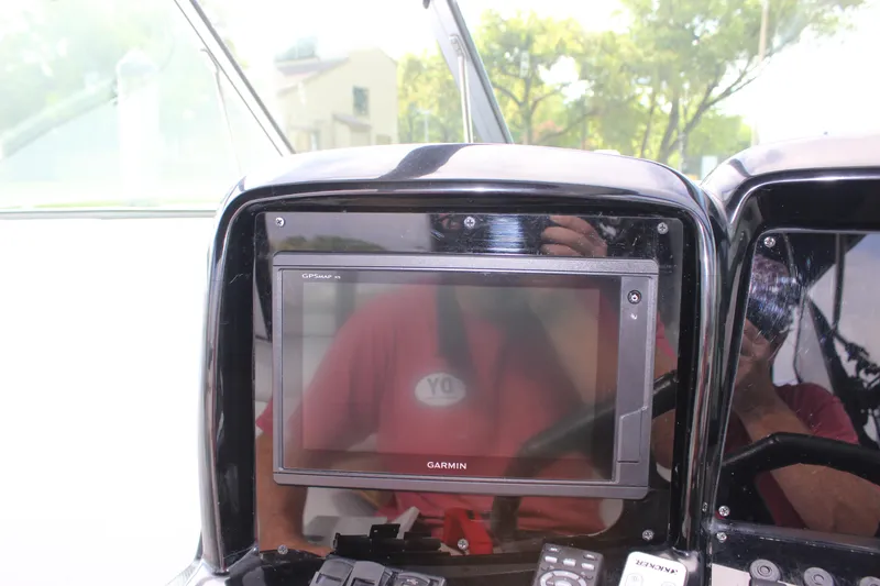 Slide: The Image of Garmin GPS display on 2011 Rinker 310 Express Cruiser dashboard. - 26
