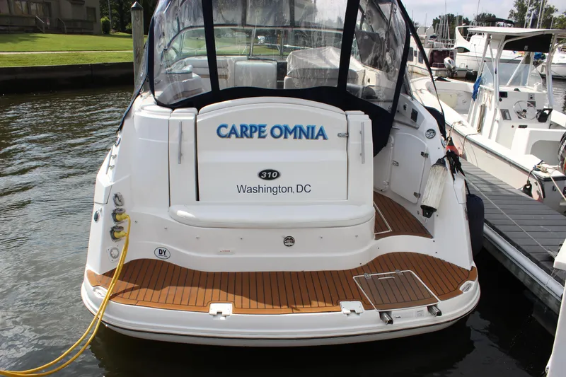 Slide: The Image of 2011 Rinker 310 Express Cruiser docked, rear view, Carpe Omnia name, Washington DC. - 32