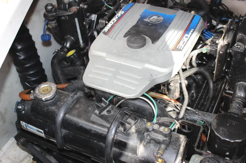 Slide: The Image of 2011 Rinker 310 Express Cruiser engine compartment with MerCruiser 350 MAG engine. - 38