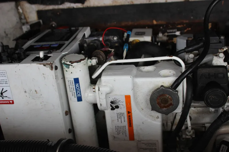 Slide: The Image of Engine compartment of a 2011 Rinker 310 Express Cruiser. - 39