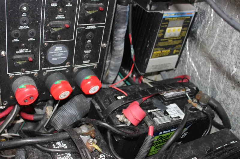 Slide: The Image of Electrical panel and battery setup in a 2011 Rinker 310 Express Cruiser. - 40