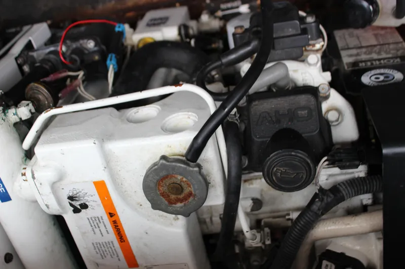Slide: The Image of Close-up of the engine compartment of a 2011 Rinker 310 Express Cruiser. - 41