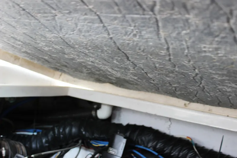 Slide: The Image of Engine compartment of a 2011 Rinker 310 Express Cruiser showing wiring and components. - 43