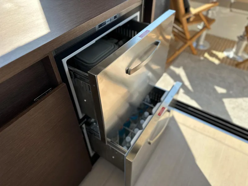 Slide: The Image of Prestige 420 S 2021 yacht with open stainless steel drawer refrigerator. - 19