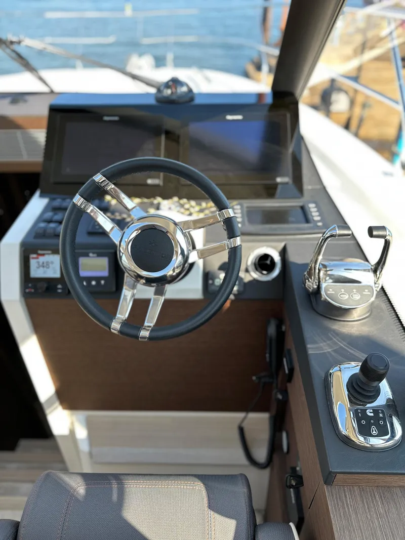 Slide: The Image of Prestige 420 S 2021 yacht helm with modern controls and navigation screens. - 28