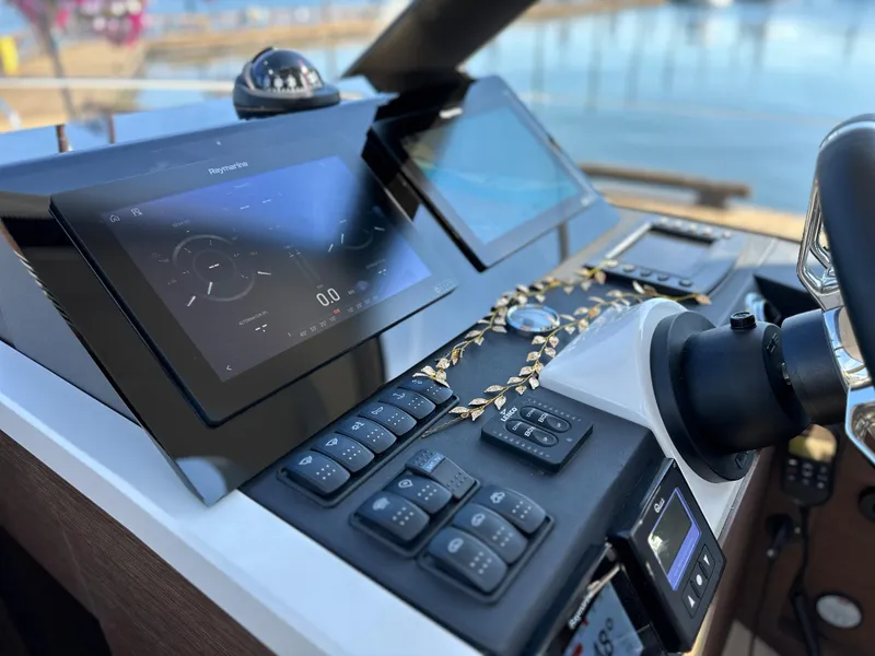Slide: The Image of Control panel of 2021 Prestige 420 S yacht with navigation screens and buttons. - 30