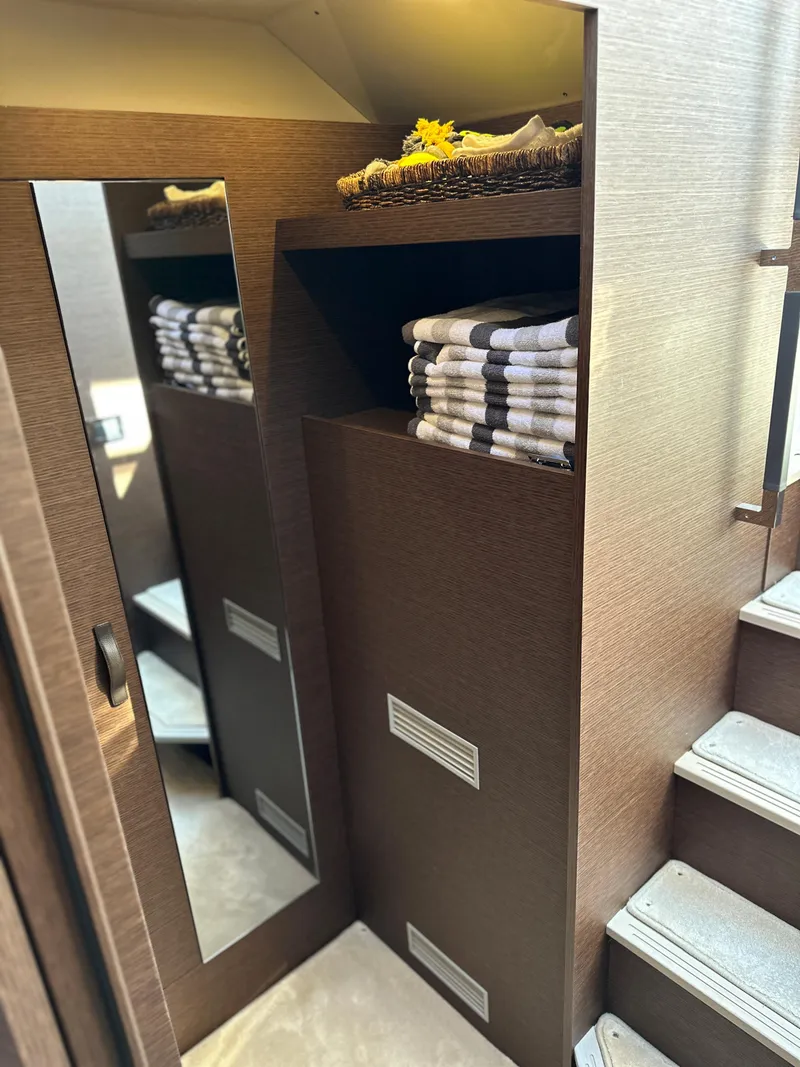 Slide: The Image of Luxury interior of 2021 Prestige 420 S yacht with mirror and towel storage. - 35