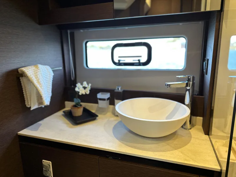 Slide: The Image of Modern bathroom sink in 2021 Prestige 420 S yacht with window view. - 39