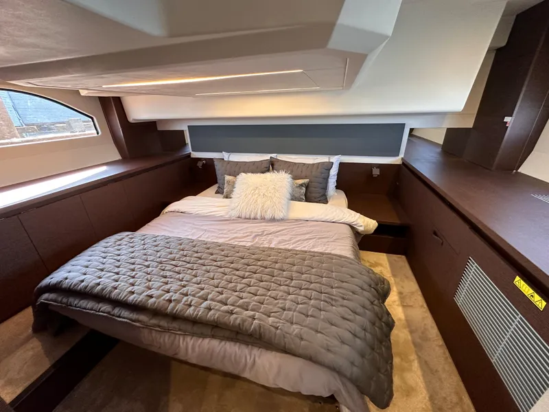 Slide: The Image of Luxurious bedroom interior of 2021 Prestige 420 S yacht with cozy bedding. - 40