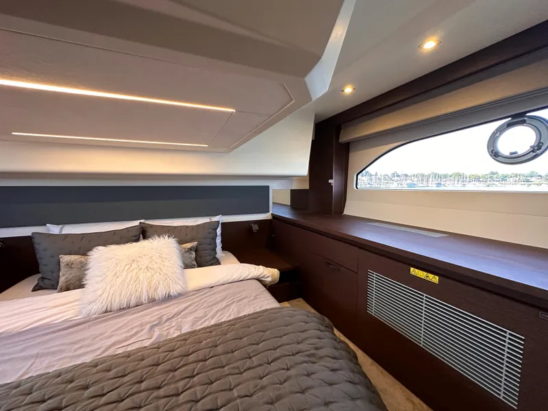 Slide: The Image of Luxurious bedroom interior of 2021 Prestige 420 S yacht with modern design and cozy bedding. - 41
