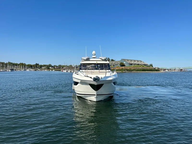 Slide: The Image of 2021 Prestige 420 S yacht cruising on a sunny day in a marina. - 8