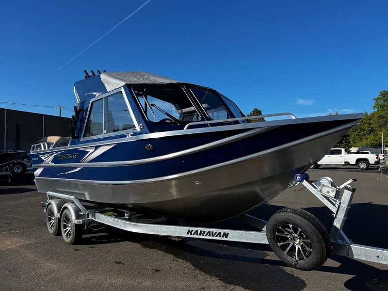 The Image of 2024 Thunder Jet 22 Alexis OS boat on Karavan trailer, parked outdoors. - 1