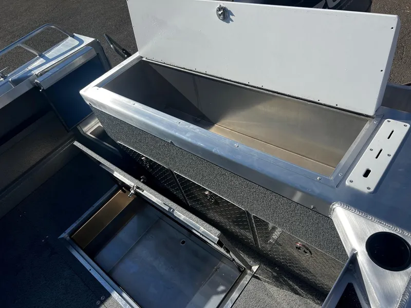 Slide: The Image of 2024 Thunder Jet 22 Alexis OS boat storage compartments and interior view. - 16