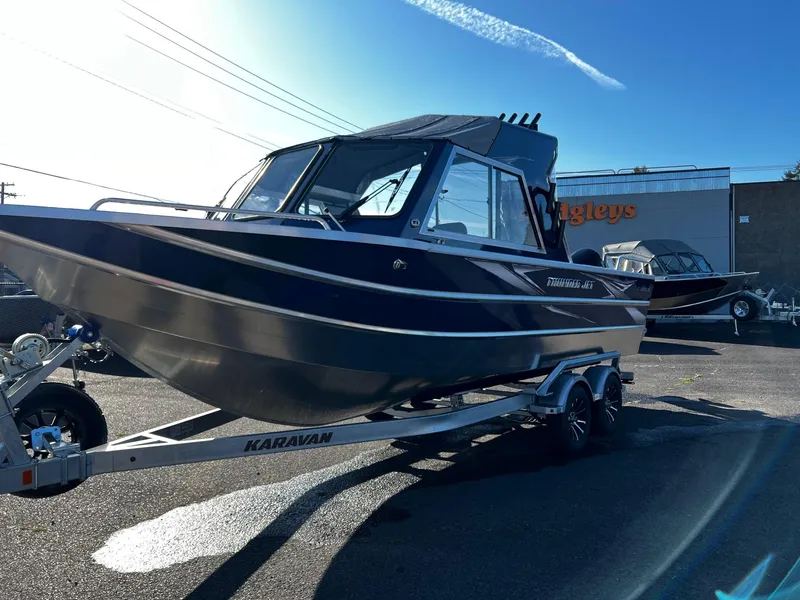 Slide: The Image of 2024 Thunder Jet 22 Alexis OS boat on Karavan trailer in outdoor lot. - 6