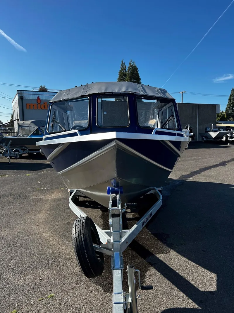 Slide: The Image of 2024 Thunder Jet 22 Alexis OS boat on a trailer, front view. - 7