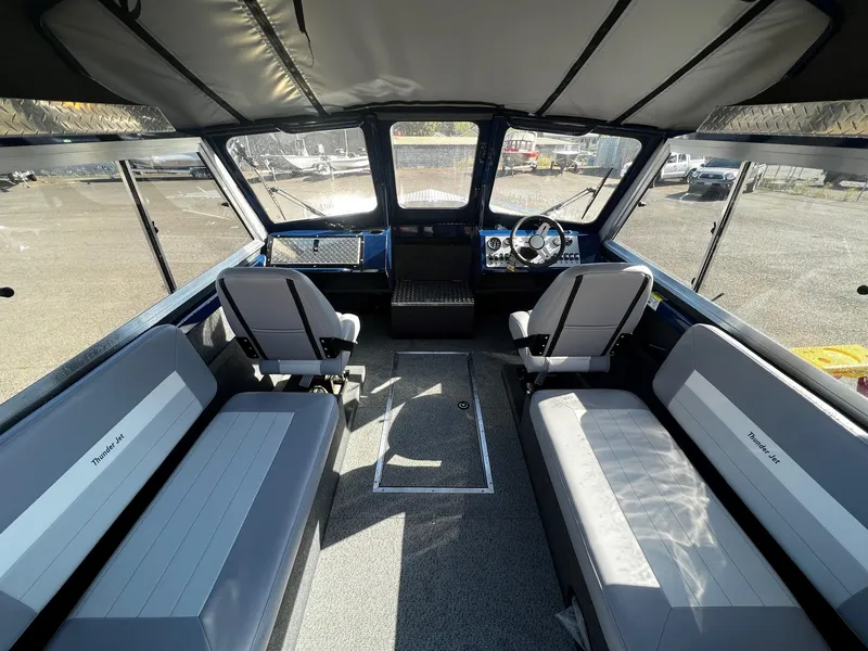 Slide: The Image of Interior of 2024 Thunder Jet 22 Alexis OS boat with seating and steering console. - 8