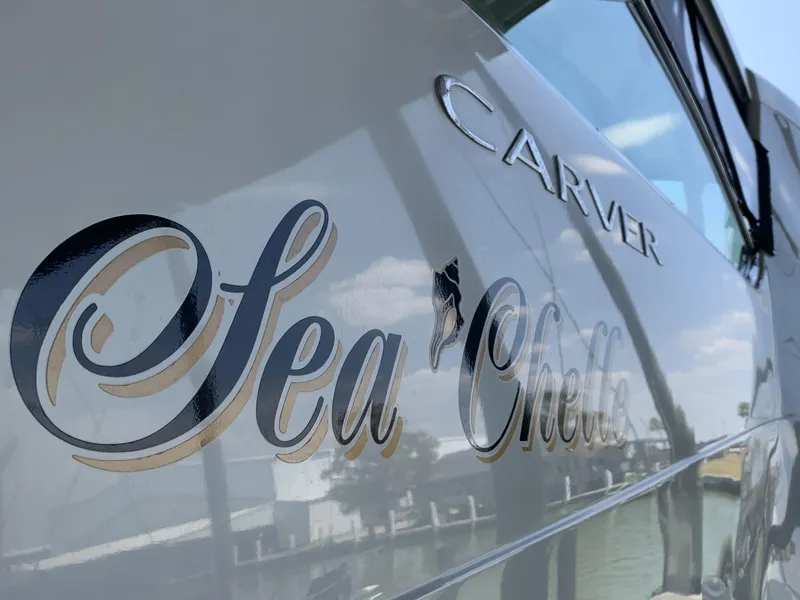 Slide: The Image of 2007 Carver 56 Voyager yacht with "Sea Chelle" name on the side. - 21