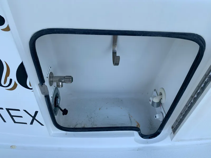 Slide: The Image of Open hatch on 2007 Carver 56 Voyager boat, showing interior compartment details. - 27