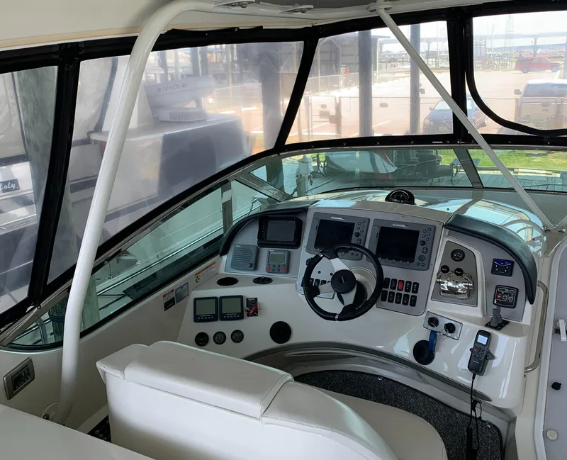 Slide: The Image of 2007 Carver 56 Voyager helm with modern navigation instruments and comfortable seating. - 35