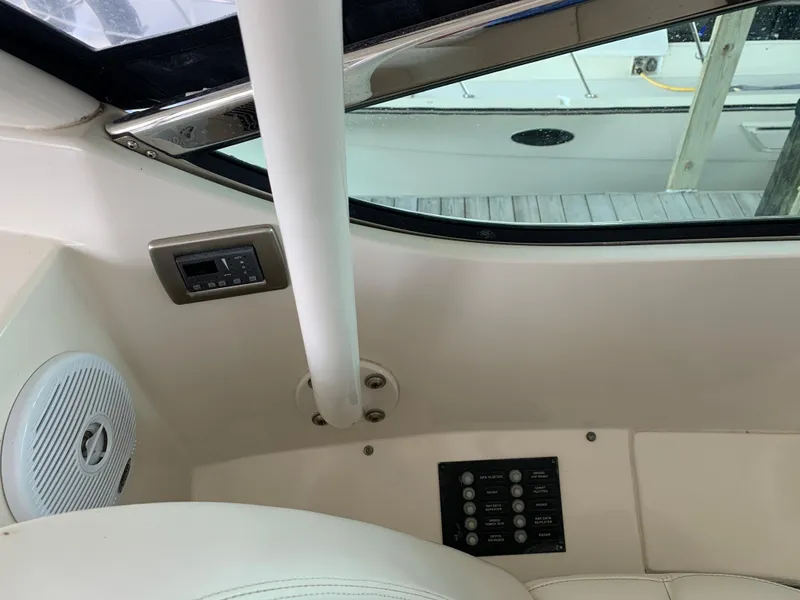 Slide: The Image of Interior view of a 2007 Carver 56 Voyager yacht, featuring control panel and speaker. - 39