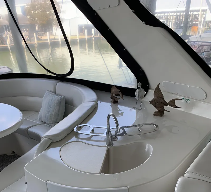 Slide: The Image of Luxurious 2007 Carver 56 Voyager yacht interior with seating and sink area. - 41