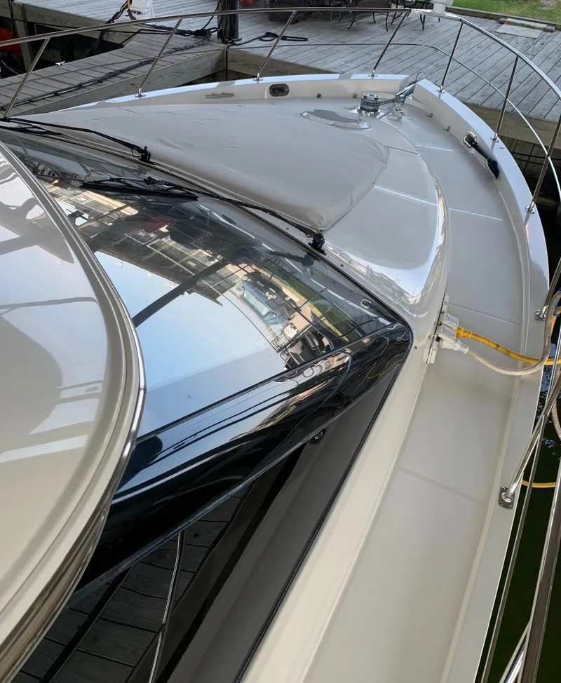 Slide: The Image of 2007 Carver 56 Voyager yacht deck with sleek design and modern features. - 19