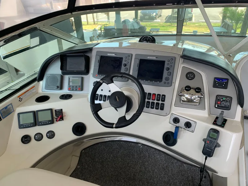 Slide: The Image of 2007 Carver 56 Voyager helm with advanced navigation and control systems. - 34