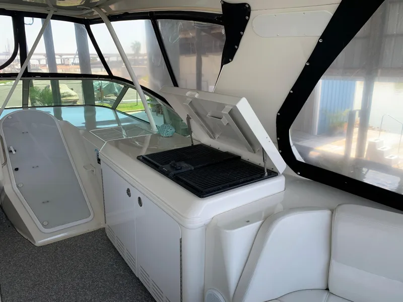 Slide: The Image of 2007 Carver 56 Voyager yacht interior with grill and seating area. - 45