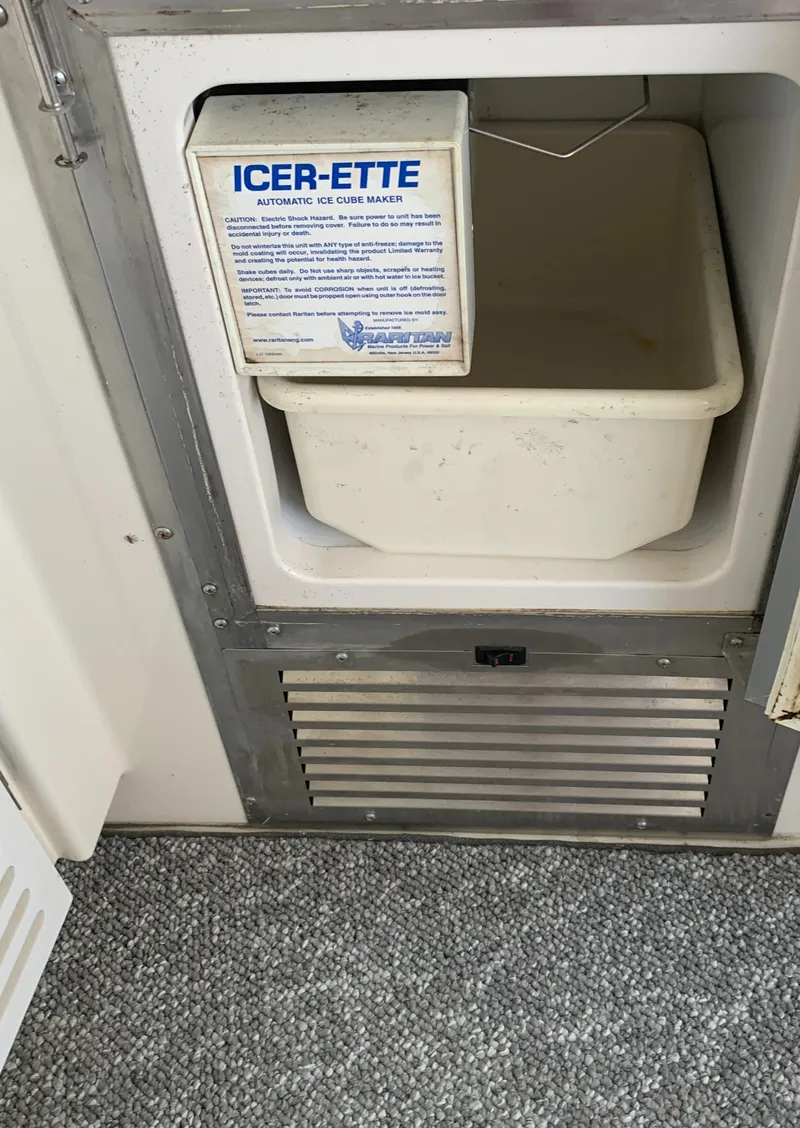 Slide: The Image of 2007 Carver 56 Voyager ice maker compartment with ICER-ETTE machine and bin. - 47