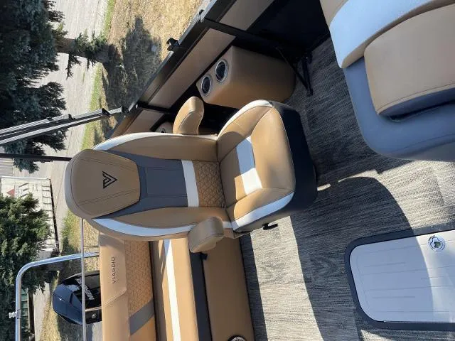 Slide: The Image of 2022 Viaggio D23S boat interior with tan and gray seating. - 12