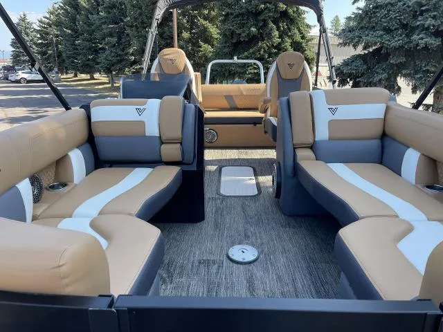 Slide: The Image of Viaggio D23S 2022 model boat interior with tan and white seating, outdoor setting. - 6