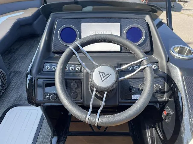 Slide: The Image of Viaggio D23S 2022 boat dashboard with steering wheel and control panel. - 7