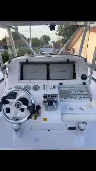 Slide: The Image of 2012 Donzi 32 ZF Open boat dashboard with Garmin navigation system. - 10