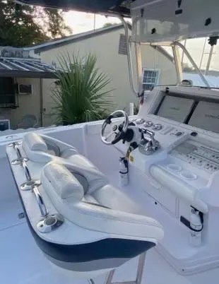 Slide: The Image of 2012 Donzi 32 ZF Open boat cockpit with dual seats and control panel. - 9