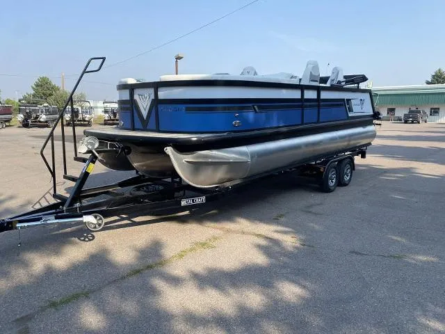 Slide: The Image of 2022 Viaggio D23Q pontoon boat on a trailer in a parking lot. - 2